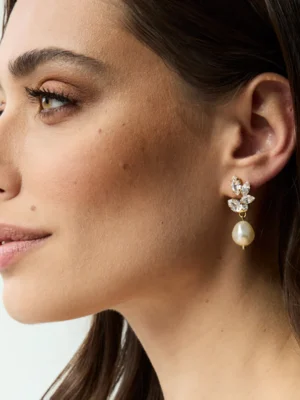 Caroline Svedbom pearls of promise earrings gold on ear