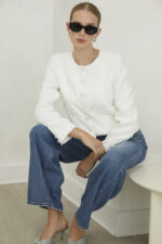 Jovonna London Tessara Jacket White Tweed with pockets and pearl buttons seated view