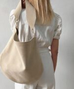 Beige Ana Italian suede leather hobo bag with wide shoulder strap.